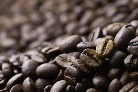 Coffee beans on wood background,shot with very shallow depth of field.の写真素材