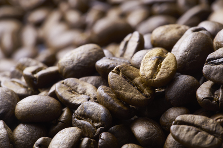 Coffee beans on wood background,shot with very shallow depth of field.の写真素材