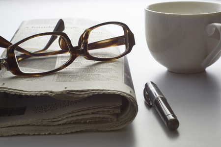 Black pen with financial figures and Glasses,shot with very shallow depth of fieldの写真素材