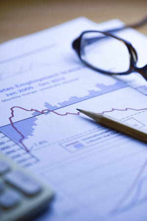 Financial data analyzing , shot with very shallow depth of field, blue toneの写真素材