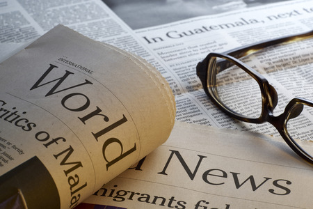 Glasses on newspaper,shot with very shallow depth of field.の写真素材