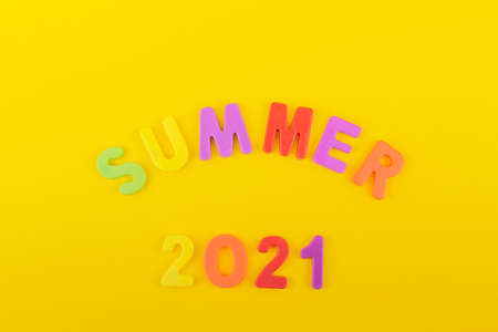 lettering of multicolored letters on a yellow background