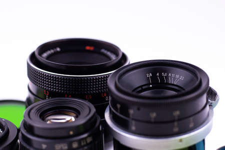 set of old-vintage lenses on a white backgroundの写真素材