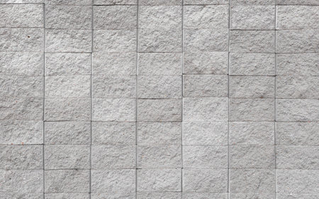 Gray brick wall background close up. Gray stone tile block background with horizontal textured...