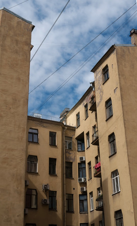Courtyard old yellow house with crumbling plasterの写真素材