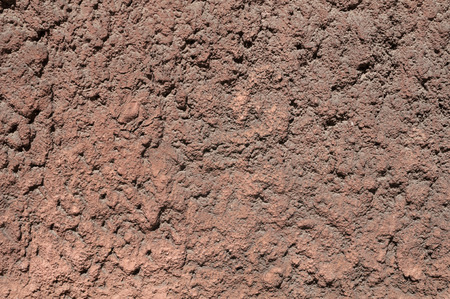 Texture of old wall with brown embossed plasterの写真素材