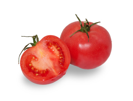 Two ripe red tomatoes, one cut isolated on white backgroundの写真素材