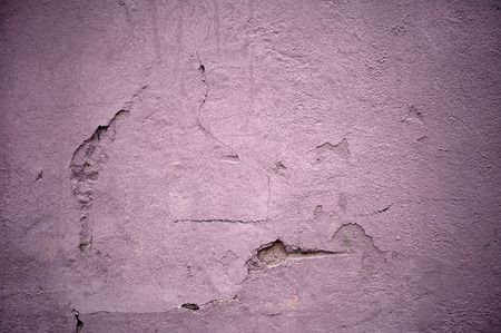 Texture of old rustic wall covered with pink stuccoの写真素材