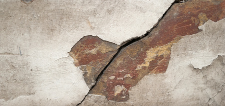 Texture of old rustic wall covered with gray stuccoの写真素材