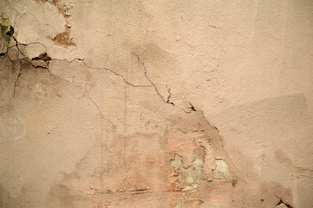 Texture of old rustic wall covered with gray stuccoの写真素材