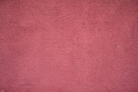 Texture of new wall covered with red stuccoの写真素材
