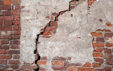 Texture of old weathered red brick wallの写真素材