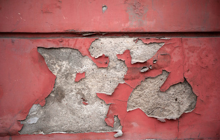 Texture of old rustic wall covered with red stucco