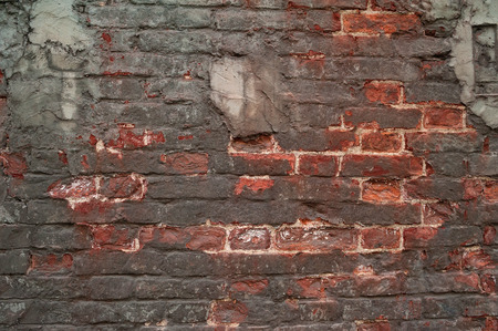 Texture of old weathered red brick wall