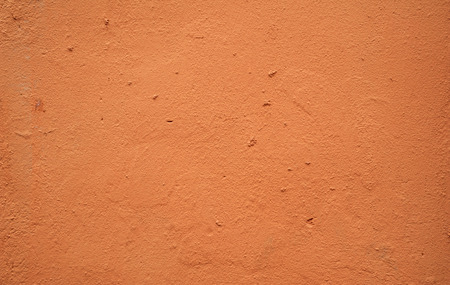 Texture of old rustic wall covered with brown stuccoの写真素材