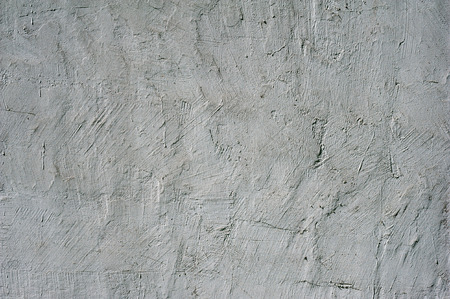 Texture of old rustic wall covered with gray stucco