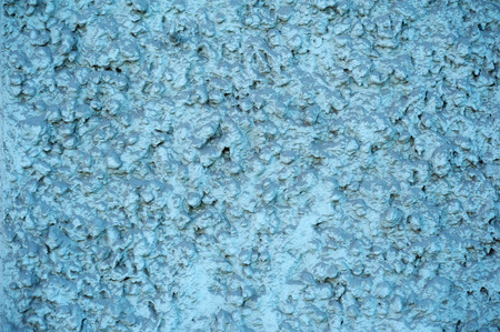 Texture of old rustic wall covered with blue stuccoの写真素材