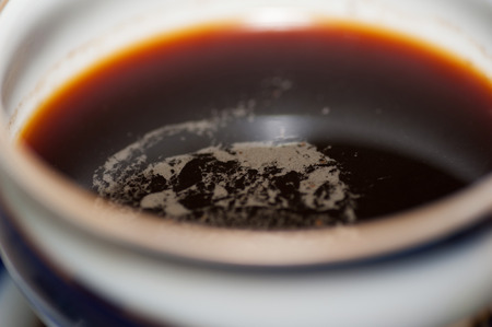 Coffee with milk in striped blue and white bowlの写真素材