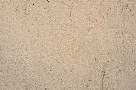 Texture of old rustic wall covered with gray stuccoの写真素材