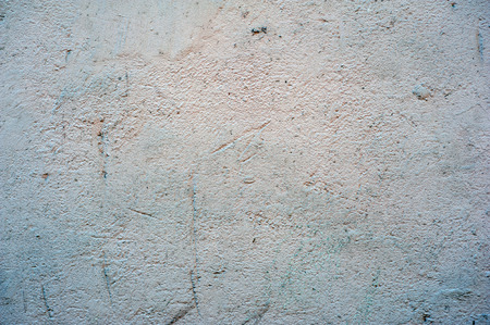 Texture of old rustic wall covered with gray stuccoの写真素材