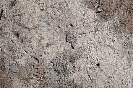 Texture of old rustic wall covered with gray stuccoの写真素材