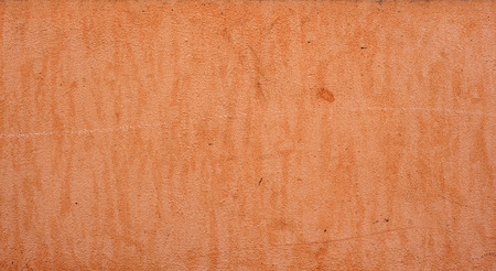 Texture of old rustic wall covered with brown stuccoの写真素材