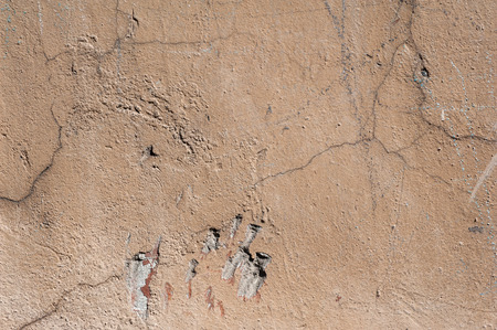 Texture of old rustic wall covered with brown stuccoの写真素材