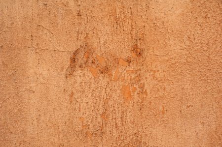 Texture of old rustic wall covered with brown stuccoの写真素材