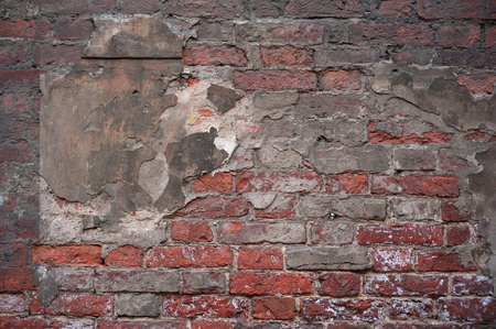 Texture of old weathered red brick wallの写真素材