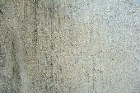 Texture of old rustic wall covered with gray stuccoの写真素材