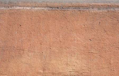 Texture of old rustic wall covered with brown stuccoの写真素材
