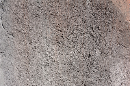 Texture of old rustic wall covered with gray stuccoの写真素材