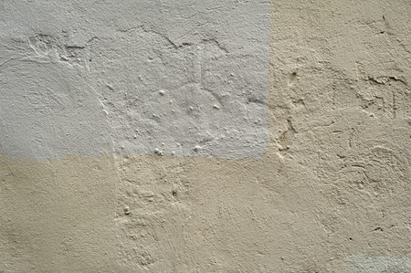 Texture of old rustic wall covered with gray stuccoの写真素材