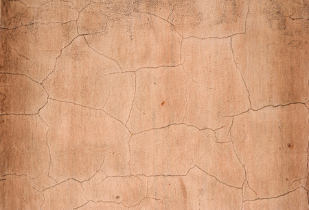 Texture of old rustic wall covered with pink stuccoの写真素材