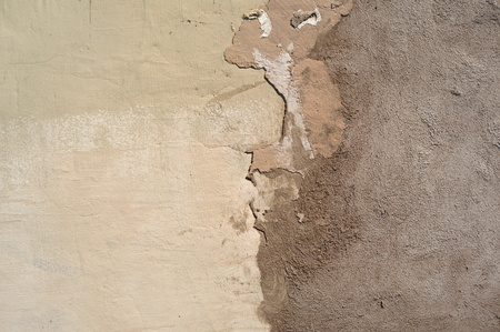 Texture of old rustic wall covered with gray stuccoの写真素材