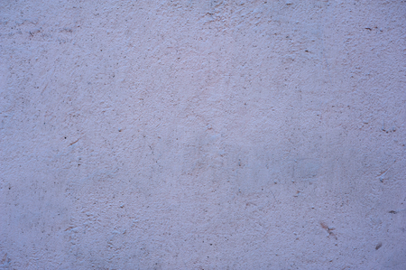 Texture of old rustic wall covered with pink stuccoの写真素材