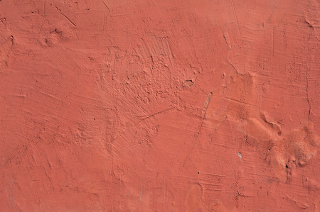 Texture of old rustic wall covered with red stuccoの写真素材