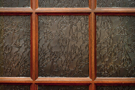 Fragment of doors, a few windows with wooden frameの写真素材