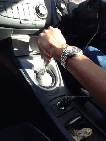 Man changing gears on carの素材