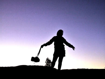 Young woman at Yosemite national park at sunsetの素材