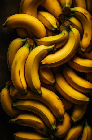 Many bright yellow bananas, background with fresh fruits.の素材