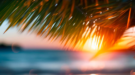 Sunset over blue ocean, tropical island with palm trees.の素材