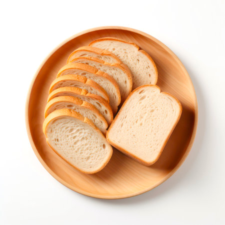 Top view on plate of sliced bread on white background.の素材