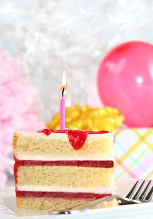 Perfect slice of delicious birthday cake. の写真素材