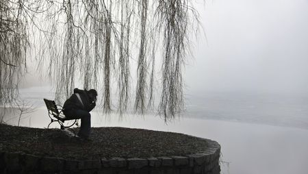 Man holding his head in depression. の写真素材