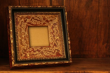 Antique picture frame in an antique wooden cabinet. の写真素材