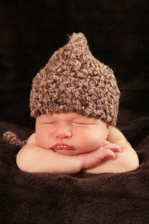 Newborn baby boy asleep on a blanket.の写真素材
