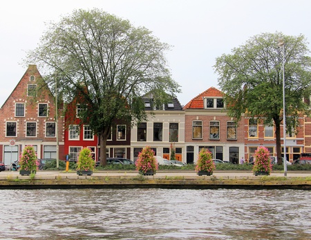 Colorful Dutch houses along the canal in Haarlem, Holland. の写真素材