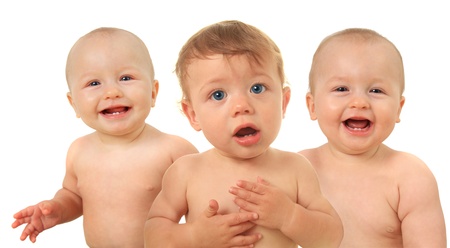 Adorable ten month old baby boy, with two baby girls in the background  の写真素材