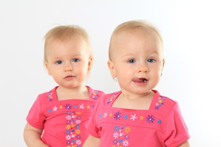 One year old twin girl  Focus on the front girl  の写真素材